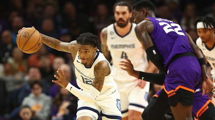 Dec 23, 2022; Phoenix, Arizona, USA; Memphis Grizzlies guard Ja Morant (12) against the Phoenix Suns in the first half at Footprint Center.